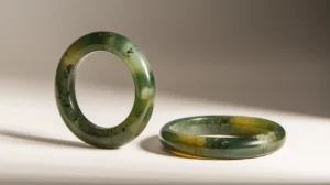 Elegant jade bangle bracelets with a sleek, polished design and natural green hues. Perfect accessory for timeless style and sophistication.